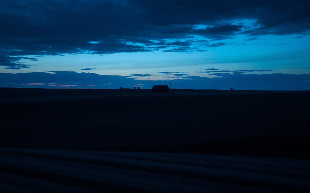 Indiana — Open farmland fields beneath a dusk sky